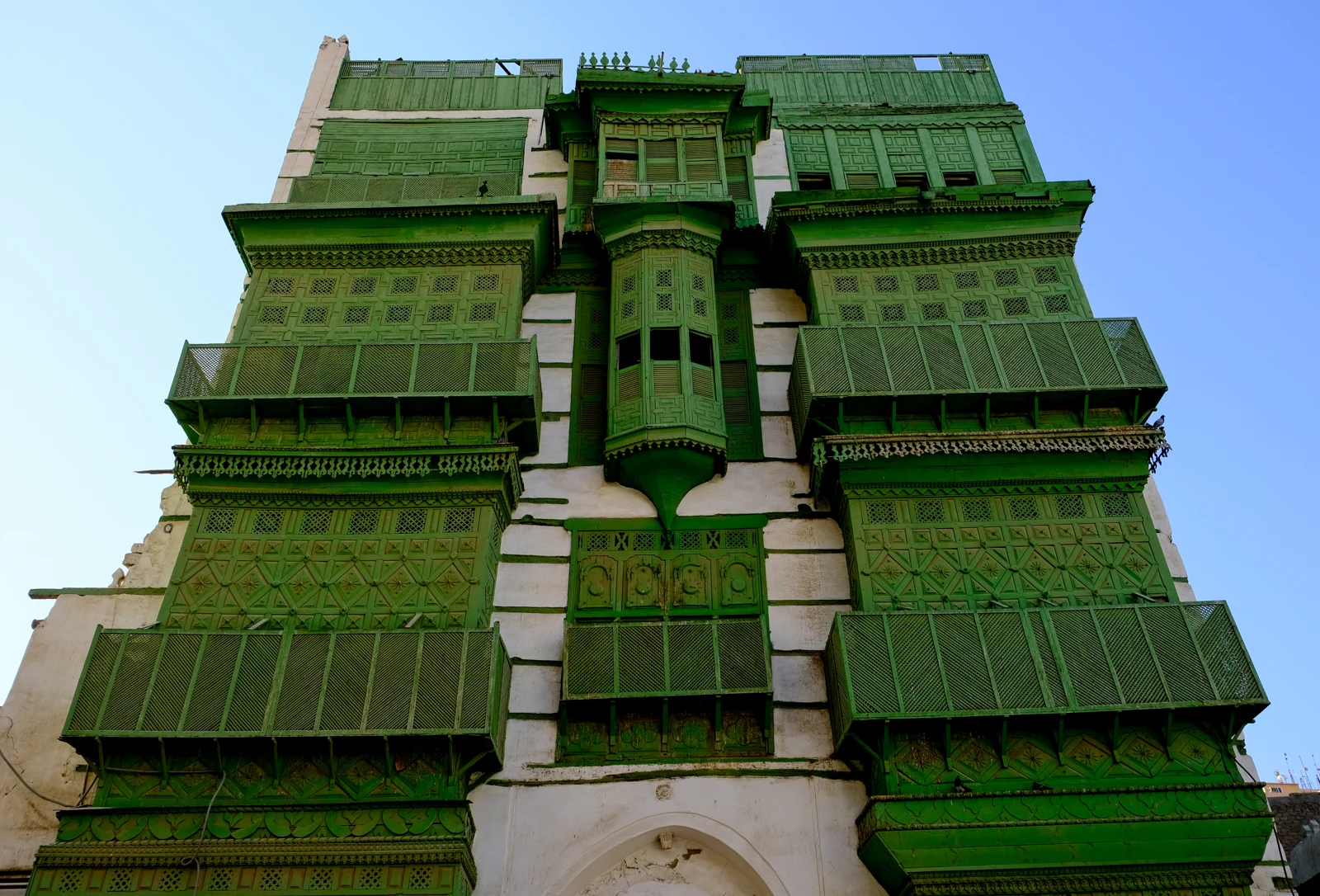 Green wooden rawasheen on a traditional building in Al Balad, Jeddah